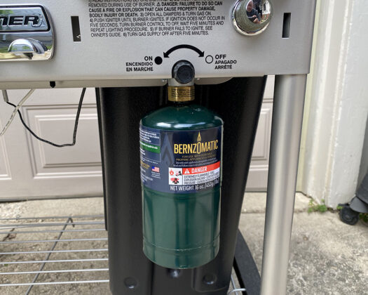 Weber Performer Deluxe Touch-N-Go igniter full view with gas cannister, on/off knob, and ignite button